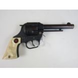 A vintage "Bronco" toy cap gun