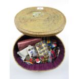 A Japanese woven sewing box with a quantity of buttons