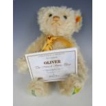 A Steiff Oliver The Musical Spring Teddy Bear, exclusively made for Danbury Mint, with box and