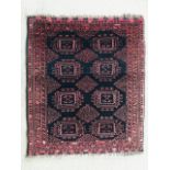 An oriental hand woven rug in black and burnt orange, 94 x 82 cm (9)