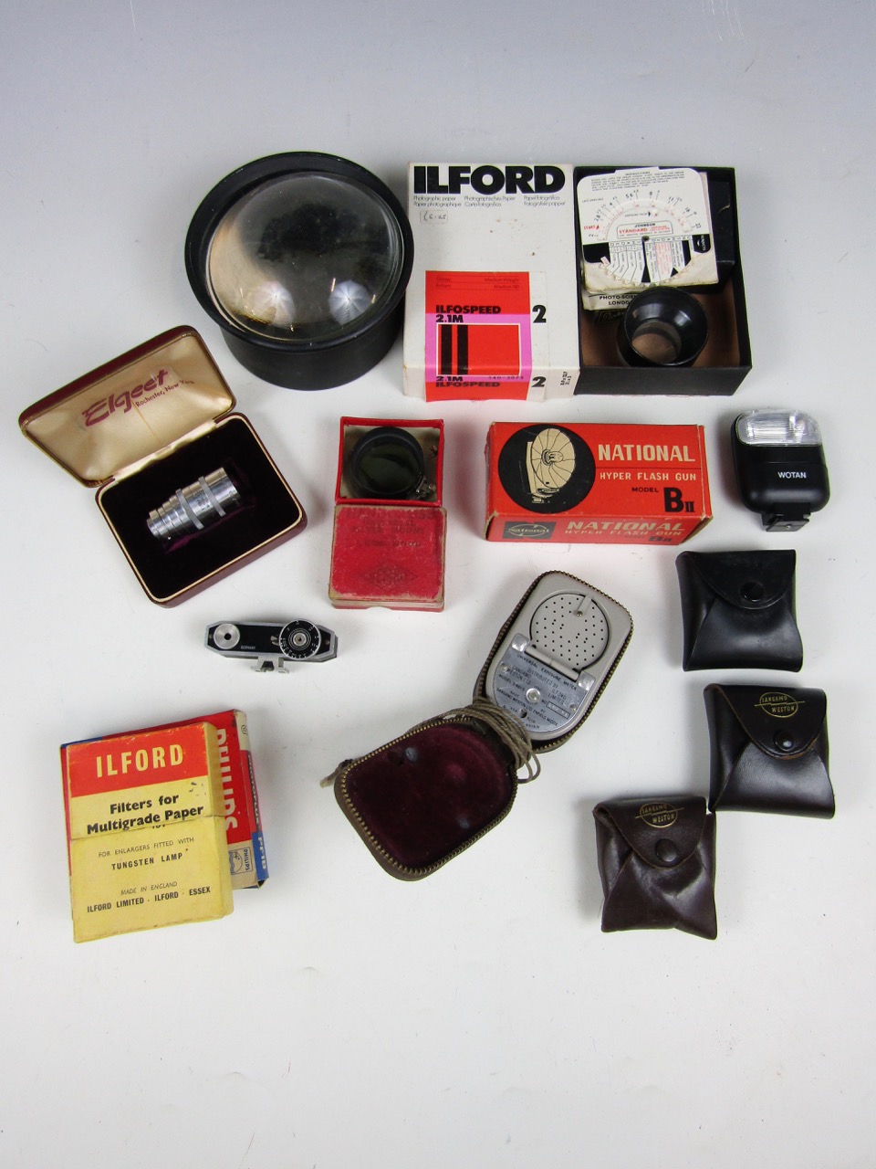 A quantity of vintage camera accessories including an Elgeet Cine Tel 38 mm F.3.5 lens, boxed, a
