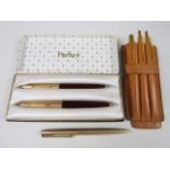 A cased 1960s Parker rolled-gold fountain and ball-point pen set, together with a similar set and