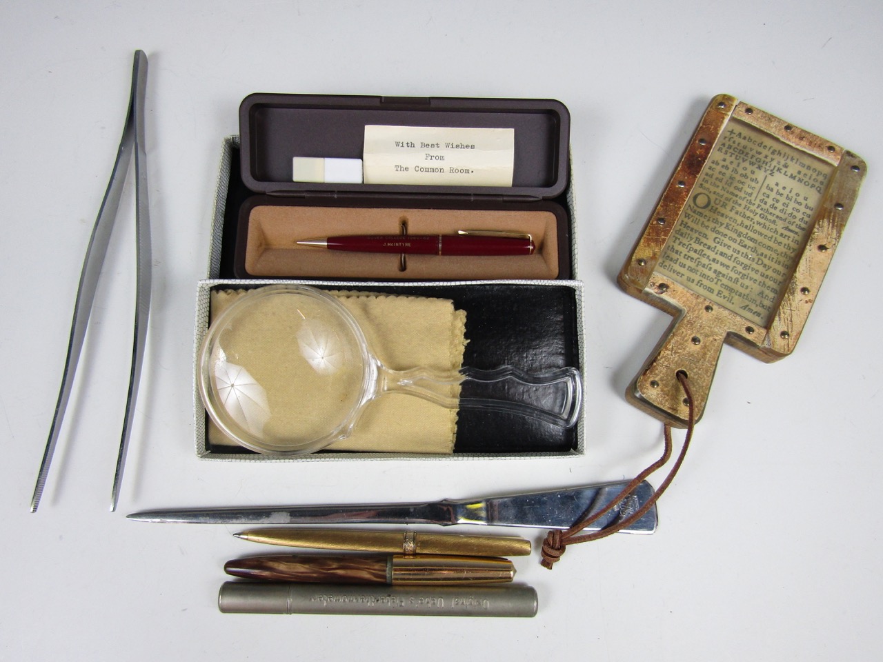 Sundry collectors' items including a Parker pencil, a letter opener, a magnifying lens and a novelty