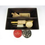 Sundry kitchenalia including a cutlery box, wooden moulds and stamps together with a vintage tin