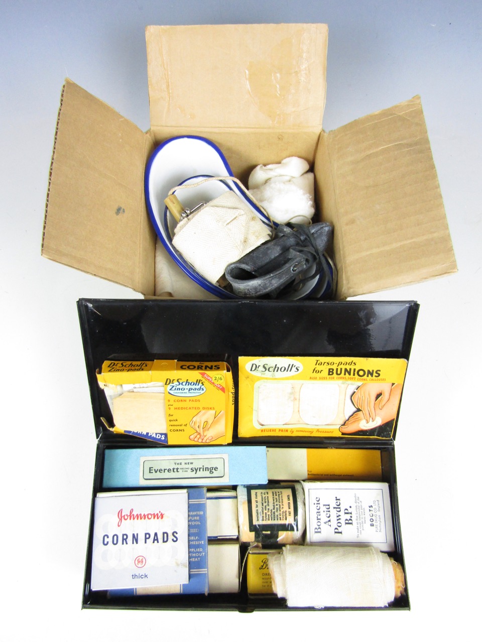 A vintage Boots first aid tin with contents together with quantity of vintage bandages and enamelled
