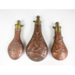 Three copper powder flasks
