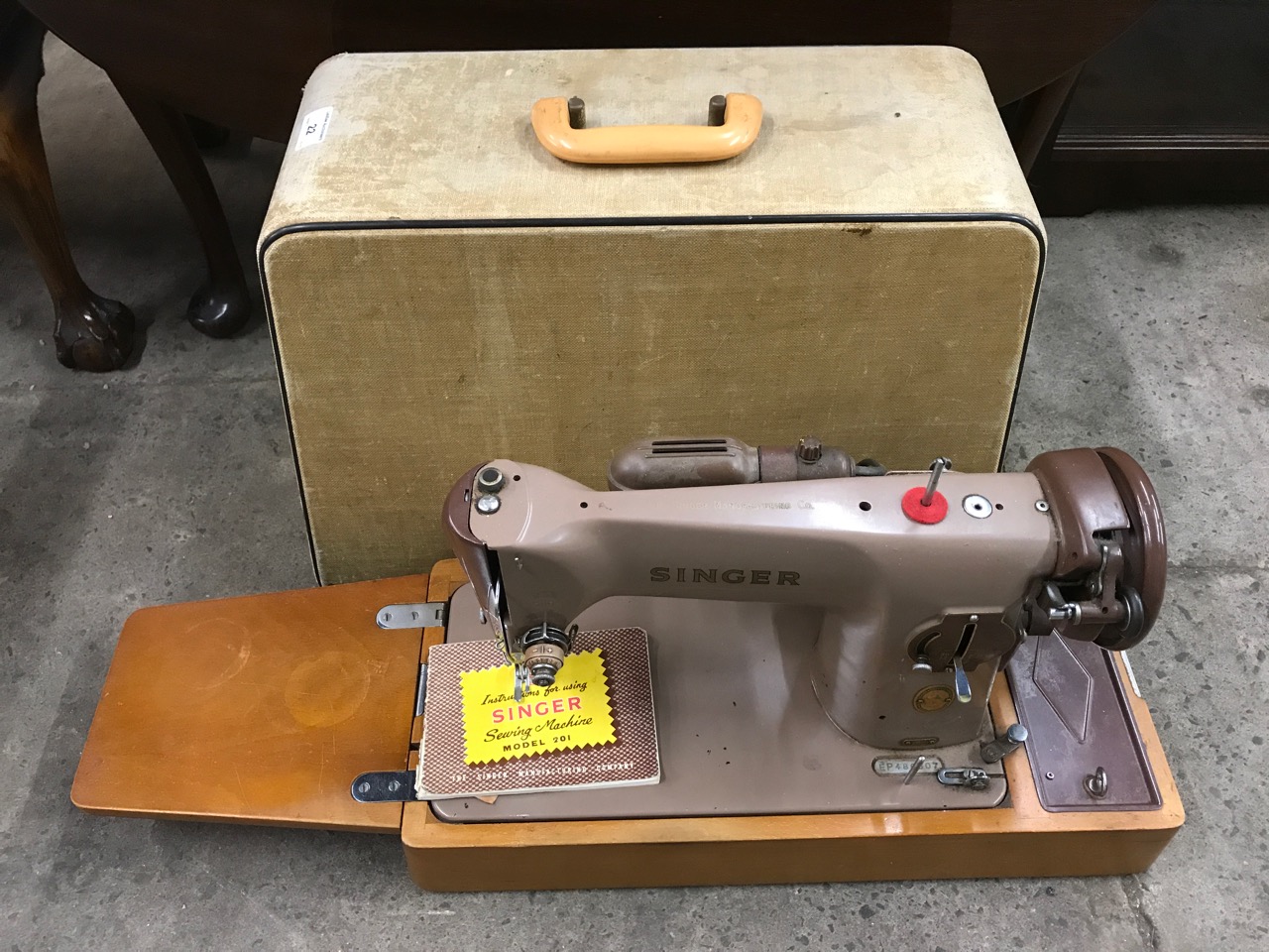 A cased electric Singer sewing machine 201