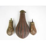 A Victorian Sykes copper powder flask and two pistol flasks