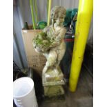 A garden statuette with plinth