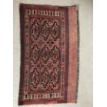 An oriental hand woven rug in earth tones, 125 x 73 cm (8)