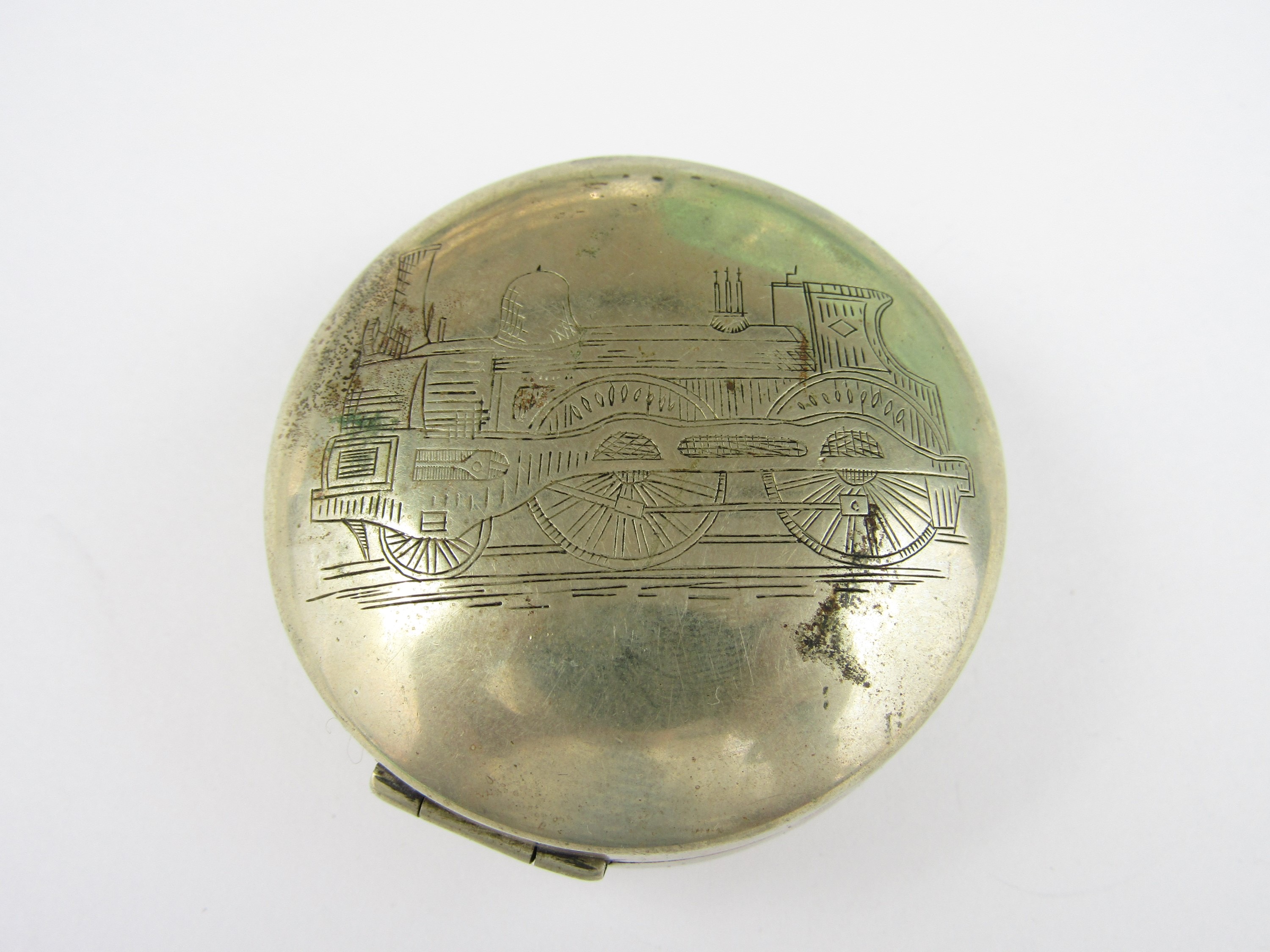 [Railway / locomotive] A Victorian nickel pocket watch case the face hand engraved in depiction of a