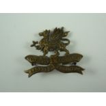 An Eleventh (Lonsdale) Battalion Border Regiment brass cap badge