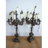 An impressive pair of late 19th Century cast brass five branch six light candelabra modelled after