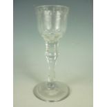 A late 18th Century wine glass, having wheel-cut ogee bowl and diamond-faceted single-knopped