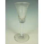 A Jacobite wine glass, having bell-form bowl with basal tears, on an opaque multiple spiral and