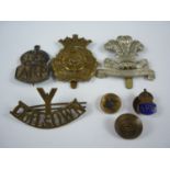A small group of British Army insignia and an escape and evasion compass, including a Duke of