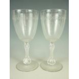 A pair of Victorian wine glasses, each having wheel cut linear decoration to the round funnel