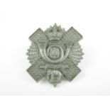 A Highland Light Infantry plastic cap badge