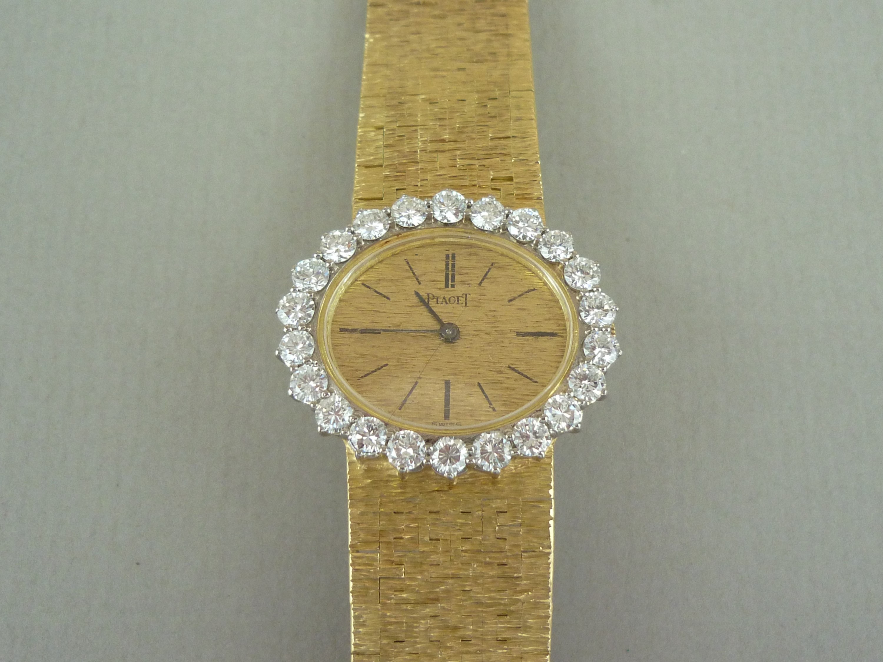 A Piaget 18ct gold and diamond cocktail watch, having crown wound movement, textured oval face