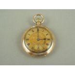A Victorian lady's high carat yellow metal fob watch, having a crown wound movement, engine turned