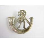 A 71st (Highland Light Infantry) strung bugle badge