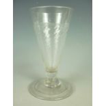 A George III ale glass, of typical wrythen-conical form, 13 cm