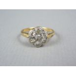 A late 19th / early 20th Century diamond flower head cluster ring, the round and brilliant cut