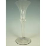 A mid 18th Century wine glass with bell-form bowl and multiple spiral air twist stem, 17 cm