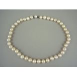 A single strand pearl necklace, the uniform pearls each of approximately 7.6mm, with concealed box