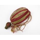 A Regency period crocheted reticule, worked in a striped design with crimson and gold coloured