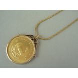 A 1974 gold Krugerrand, held in a 9ct hold pendant mount, on a 9ct gold box link neck chain, 43.7g