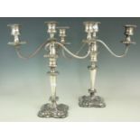 A pair of Victorian two-branch three light electroplate candelabra, 41 cm