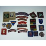 A quantity of largely Second World War British military cloth insignia