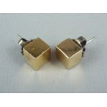 A pair of yellow metal cubic ear studs, test as gold, 6g