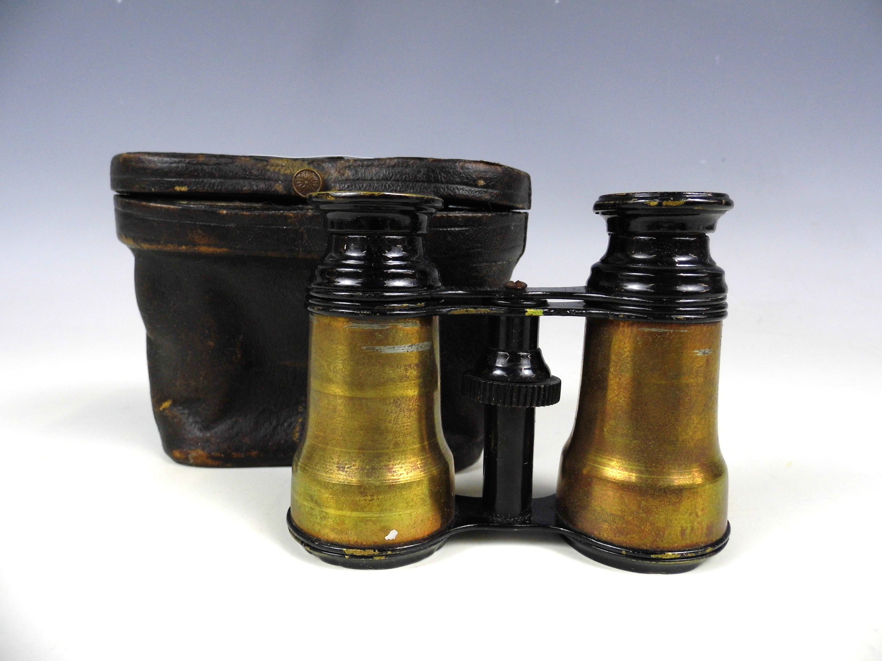 A cased pair of vintage opera glasses