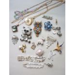 A quantity of vintage costume jewellery including a Butler and Wilson novelty westie brooch and