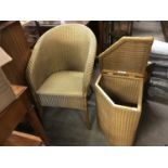 A Lloyd Loom chair together with a Lloyd Loom laundry basket