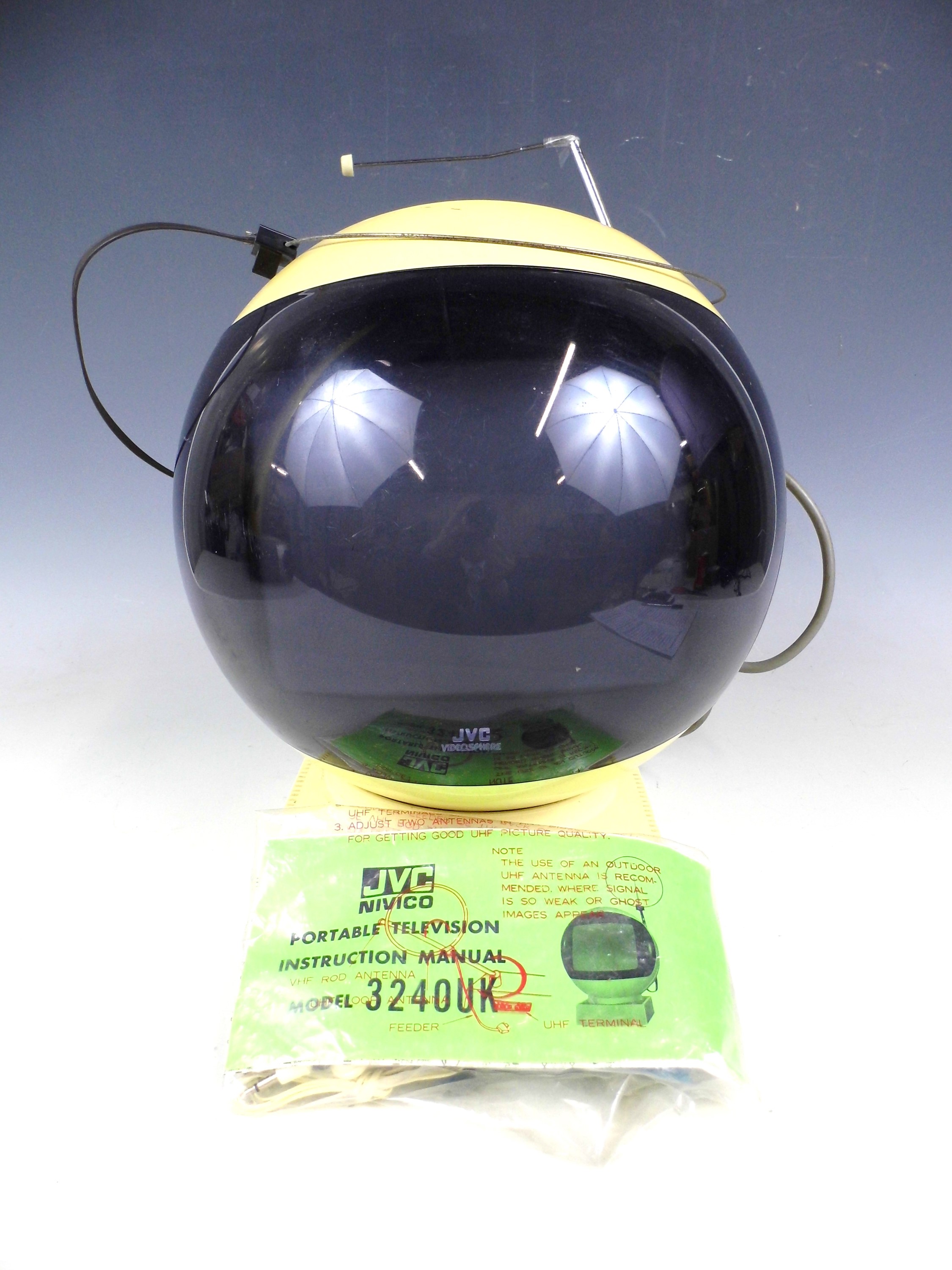 A novelty Space helmet shaped TV with stand