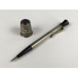 A vintage white metal and black celluloid propelling pencil, stamped sterling silver, and a white