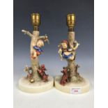 A pair of Goebel figural lamp bases with shades