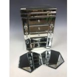 A contemporary mirrored jewellery box together with two mirrored display stands