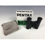 A boxed set of Pentas 7x20 roof prism binoculars