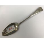 A Georgian Silver Hanoverian pattern table spoon, with engraved armorial crest to terminal, HS,