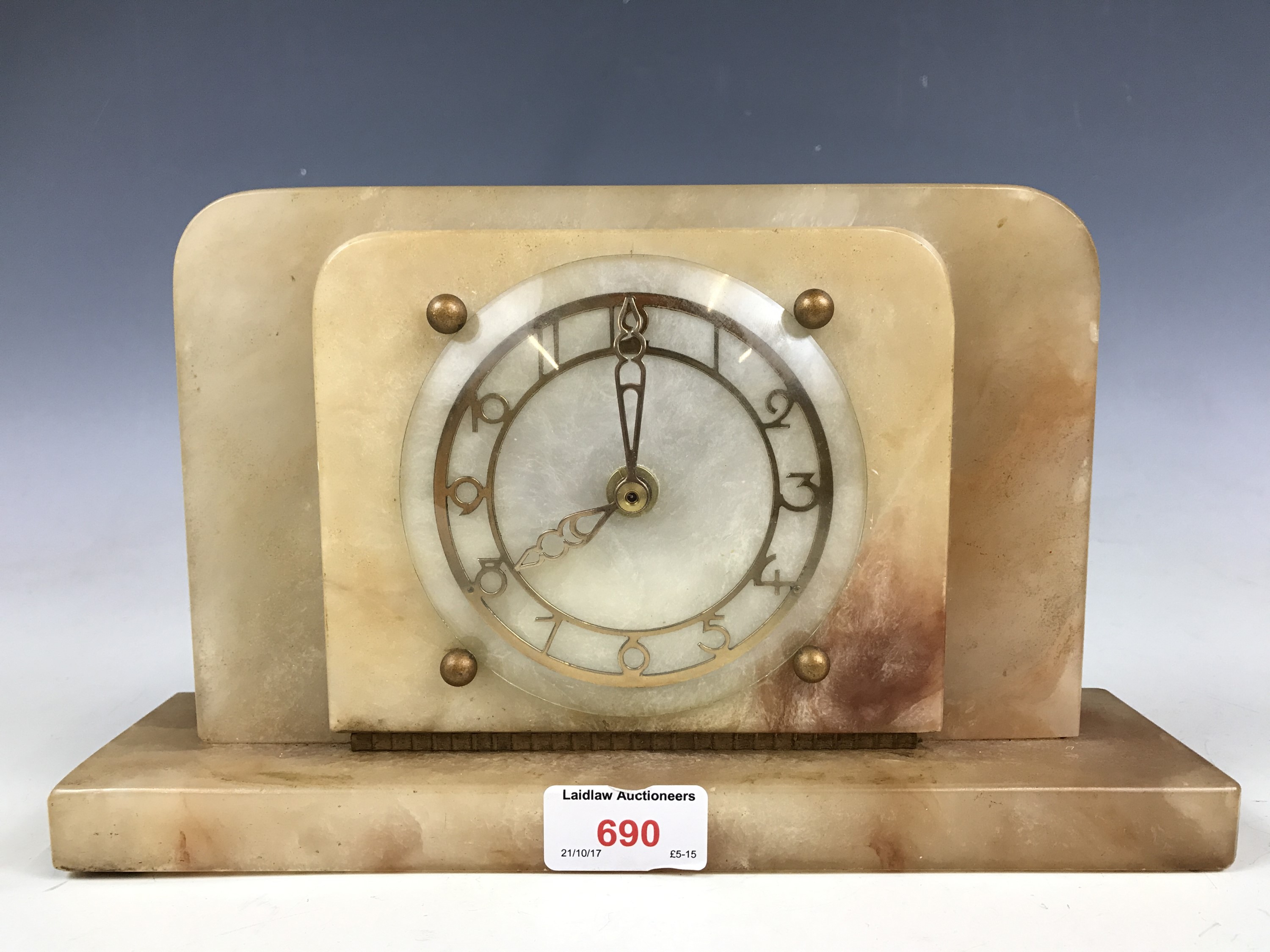 An onyx cased mantel clock