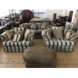 A quality four piece suite comprising a large three seater sofa and two large armchairs together