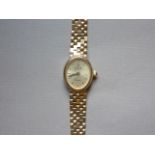 A contemporary lady's 9K gold cased VicencE wristwatch, with quartz movement and 9ct gold bracelet