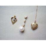 A 9ct gold heart shaped locket on chain together with two further pendants