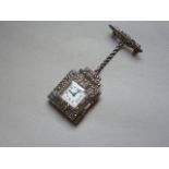 A vintage silver cased pendant fob watch with marcasite bezel and brooch