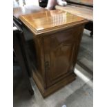 A Victorian oak bedside cabinet