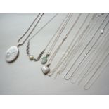 Eleven contemporary white metal necklaces, including two lockets and a Mexican white metal